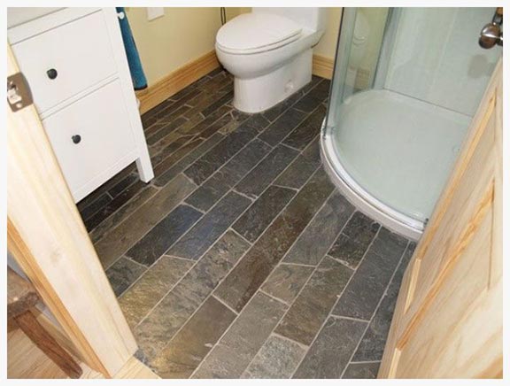 bathroom with slate board floor